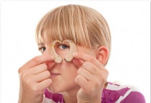 woman looking through hearing aids
